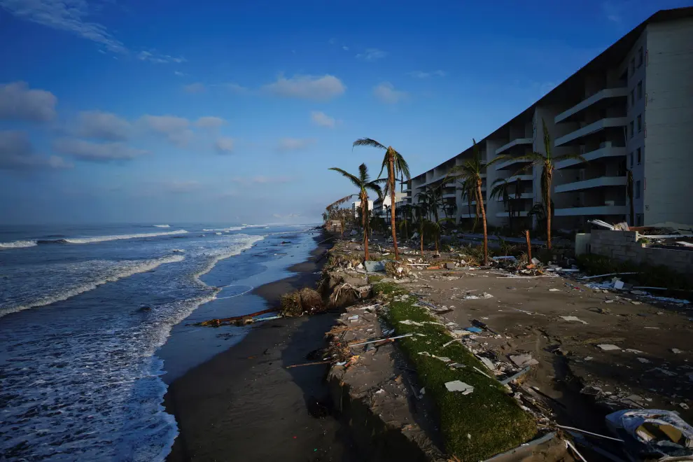 A man walks next to a knocked down truck, in the aftermath of Hurricane Otis, in Acapulco's Diamond Zone, Mexico, October 27, 2023. REUTERS/Quetzalli Nicte-Ha STORM-OTIS/