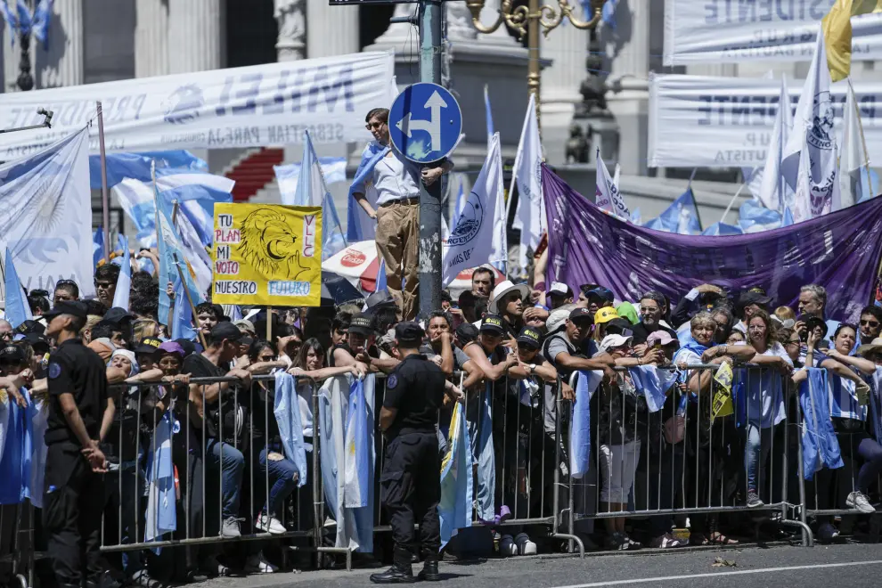 Supporters of Argentina's incoming President Javier Milei gather outside the Congress prior to his swearing-in ceremony in Buenos Aires, Argentina, Sunday, Dec. 10, 2023. (AP Photo/Rodrigo Abd)
