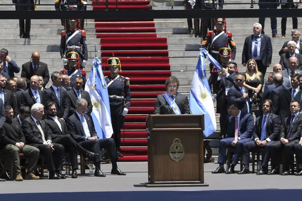 Argentina's newly sworn-in President Javier Milei speaks outside the Congress in Buenos Aires, Argentina, Sunday, Dec. 10, 2023. (AP Photo/Gustavo Garello)