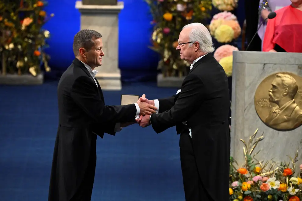 Moungi G. is awarded the Nobel Prize in Chemistry 2023 by King Carl Gustaf of Sweden during the Nobel Prize award ceremony at the Concert Hall in Stockholm, Sweden on December 10, 2023. Claudio Bresciani/TT News Agency/via REUTERS      ATTENTION EDITORS - THIS IMAGE WAS PROVIDED BY A THIRD PARTY. SWEDEN OUT. NO COMMERCIAL OR EDITORIAL SALES IN SWEDEN. [[[REUTERS VOCENTO]]] NOBEL-PRIZE/