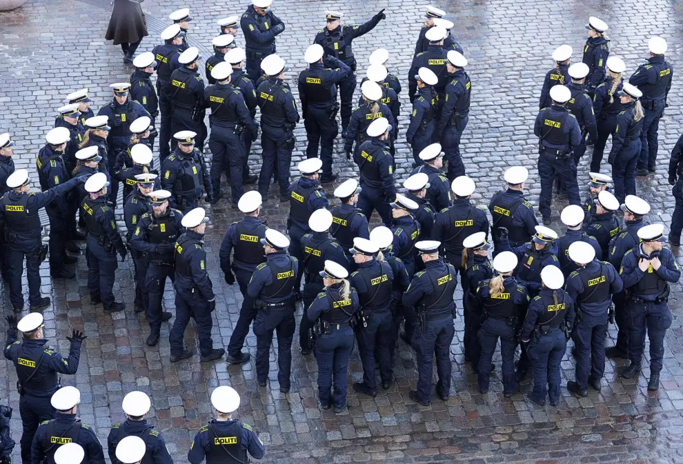Copenhagen (Denmark), 14/01/2024.- Police gather before the drive from Amalienborg Castle to Christiansborg Castle of Queen Margrethe's abdication in Copenhagen, Denmark, 14 January 2024. Queen Margrethe had her last official task on 08 January as the head of the Danish royal house. Denmark's Queen Margrethe II announced in her New Year's speech on 31 December 2023 that she would abdicate on 14 January 2024, the 52nd anniversary of her accession to the throne. Her eldest son, Crown Prince Frederik, is set to succeed his mother on the Danish throne as King Frederik X. His son, Prince Christian, will become the new Crown Prince of Denmark following his father's coronation. (Dinamarca, Copenhague) EFE/EPA/CLAUS BECH DENMARK OUT
