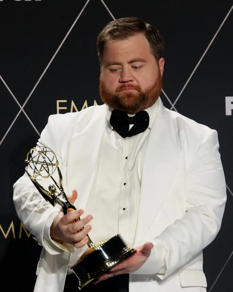 Lee Sung Jin accepts the award for Writing for a Limited/Anthology Series or Movie for [[[REUTERS VOCENTO]]] AWARDS-EMMYS/