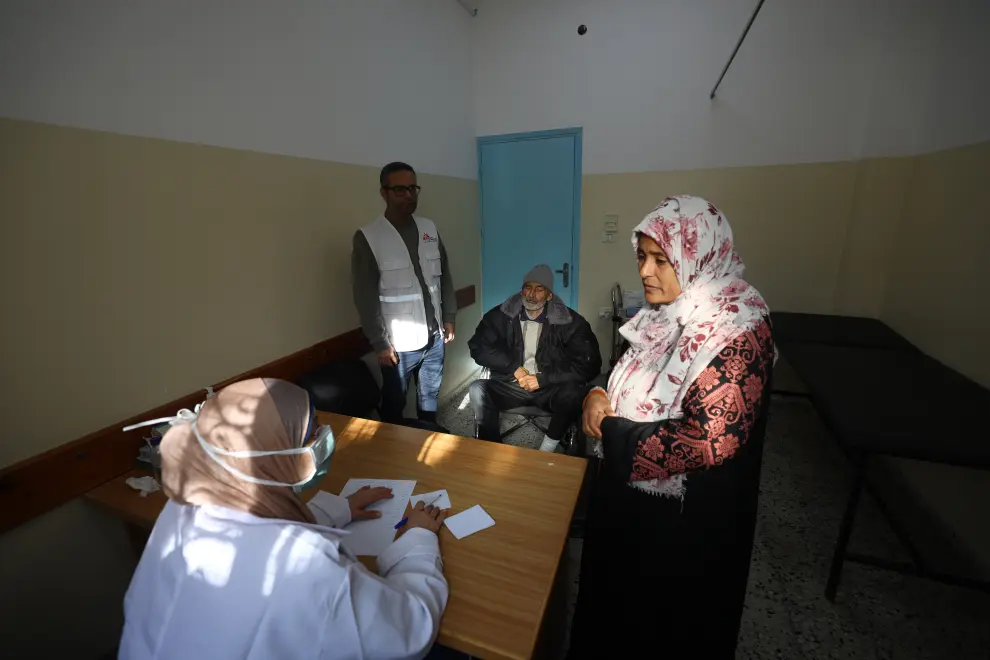 An MSF health worker attends people at the waiting area in Al-Shaboura clinic (Rafah, Gaza). The clinic was closed since the beginning of the war and was reopened on December 9 by an MSF team. Day by day, the number of patients who are coming is increasing. Around 300 patients per day.

In December 2023, Rafah has become the most densely populated area in the Gaza strip, hosting nearly half of the 1.9 million displaced people. With so many people living in appalling conditions, struggling to find enough water and meet their hygiene needs, and living in flimsy shelters made from a few pieces of wood and plastic sheeting; the situation has become a health crisis. Half of the patients MSF teams are seeing in Al-Shaboura clinic, are coming in with respiratory tract infections due to prolonged exposure to cold and rain. Due to the high number of patients, and lack of fuel and supplies, the health system is unable to cope, and people are not receiving the timely care they need.
