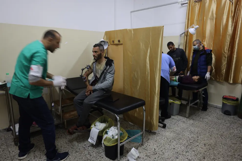 An MSF health worker attends people at the waiting area in Al-Shaboura clinic (Rafah, Gaza). The clinic was closed since the beginning of the war and was reopened on December 9 by an MSF team. Day by day, the number of patients who are coming is increasing. Around 300 patients per day.