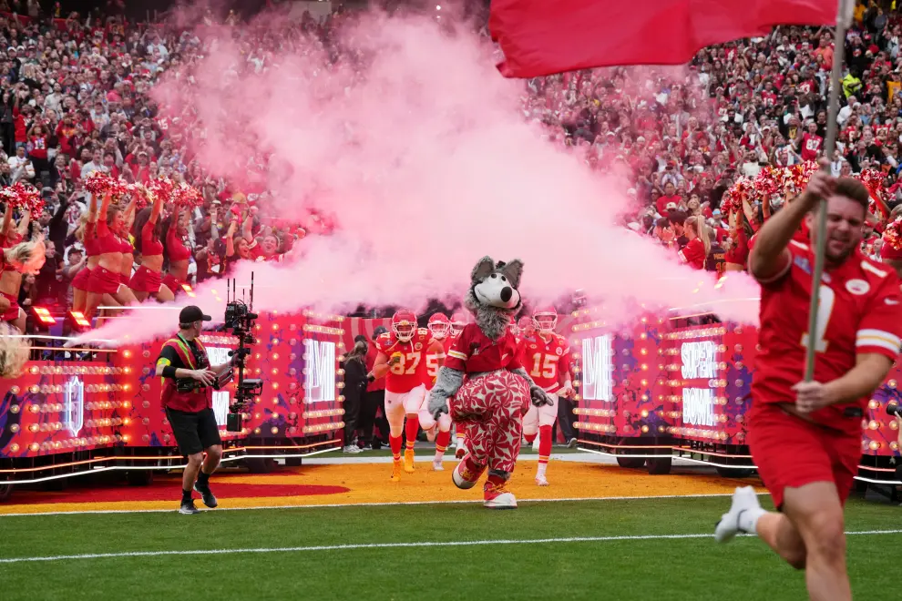 Feb 11, 2024; Paradise, Nevada, USA; Kansas City Chiefs mascot K.C. Wolf leads the team onto the field before Super Bowl LVIII against the San Francisco 49ers at Allegiant Stadium. Mandatory Credit [[[REUTERS VOCENTO]]] FOOTBALL-NFL-KC-SF/