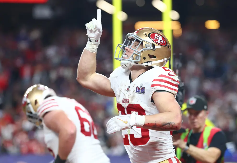 Feb 11, 2024; Paradise, Nevada, USA; San Francisco 49ers running back Christian McCaffrey (23) scores a touchdown against the Kansas City Chiefs in the first half of Super Bowl LVIII at Allegiant Stadium. Mandatory Credit [[[REUTERS VOCENTO]]] FOOTBALL-NFL-KC-SF/