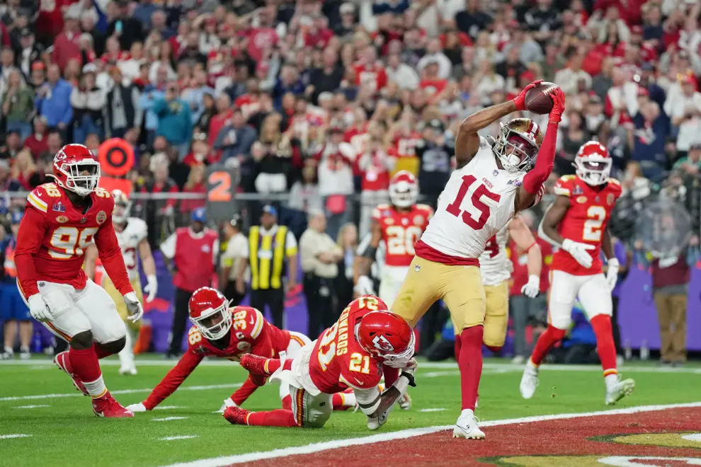 Feb 11, 2024; Paradise, Nevada, USA; San Francisco 49ers wide receiver Jauan Jennings (15) makes a catch for a touchdown against the Kansas City Chiefs during the fourth quarter of Super Bowl LVIII at Allegiant Stadium. Mandatory Credit [[[REUTERS VOCENTO]]] FOOTBALL-NFL-KC-SF/