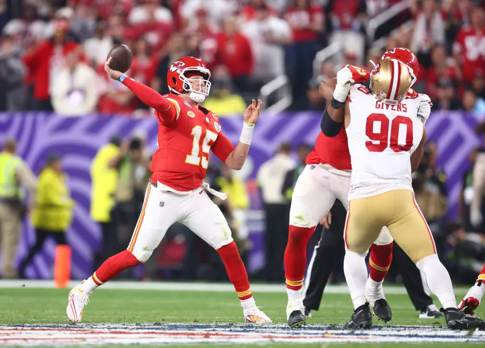 Feb 11, 2024; Paradise, Nevada, USA; Kansas City Chiefs quarterback Patrick Mahomes (15) throws a pass against the San Francisco 49ers in the fourth quarter in Super Bowl LVIII at Allegiant Stadium. Mandatory Credit [[[REUTERS VOCENTO]]] FOOTBALL-NFL-KC-SF/