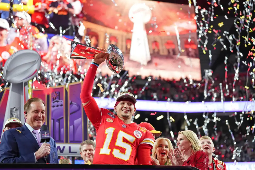 Feb 11, 2024; Paradise, Nevada, USA; Kansas City Chiefs quarterback Patrick Mahomes (15) holds the the Vince Lombardi Trophy after winning Super Bowl LVIII against the San Francisco 49ers at Allegiant Stadium. Mandatory Credit [[[REUTERS VOCENTO]]] FOOTBALL-NFL-KC-SF/