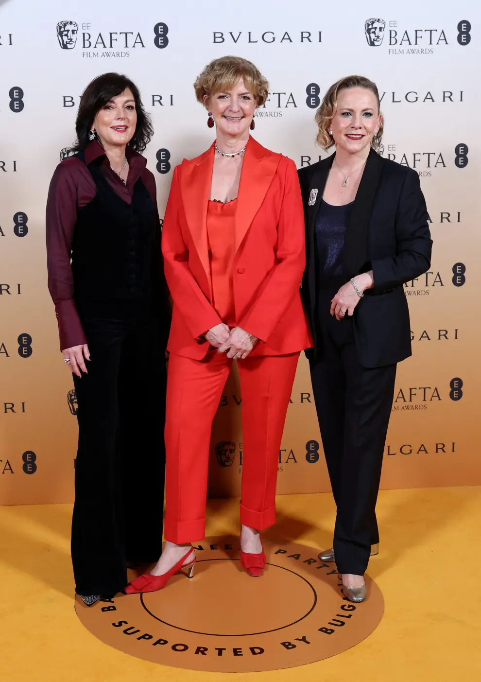 BAFTA CEO Jane Millichip, BAFTA Chair Sara Putt and Anna Higgs pose as they arrive at the Nominees Party for 2024 BAFTA Film Awards, supported by Bulgari, at the National Gallery in London, Britain, February 17, 2024. REUTERS/Isabel Infantes [[[REUTERS VOCENTO]]] AWARDS-BAFTA/NOMINEES-PARTY