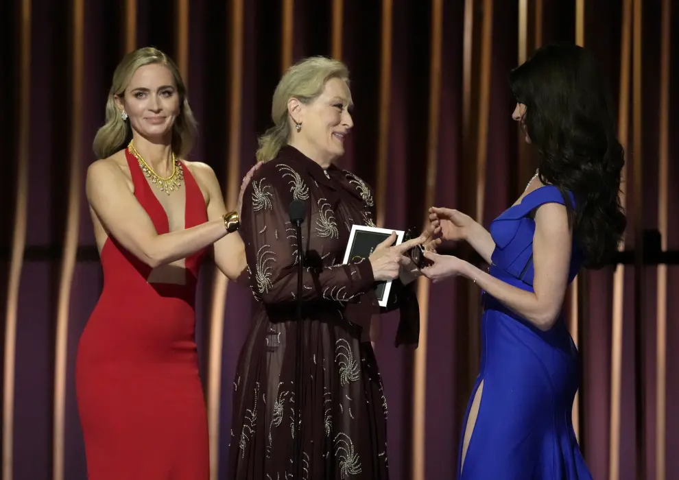 Emily Blunt, from left, Meryl Streep, and Anne Hathaway present the award for outstanding performance by a male actor in a comedy series during the 30th annual Screen Actors Guild Awards on Saturday, Feb. 24, 2024, at the Shrine Auditorium in Los Angeles. (AP Photo/Chris Pizzello)