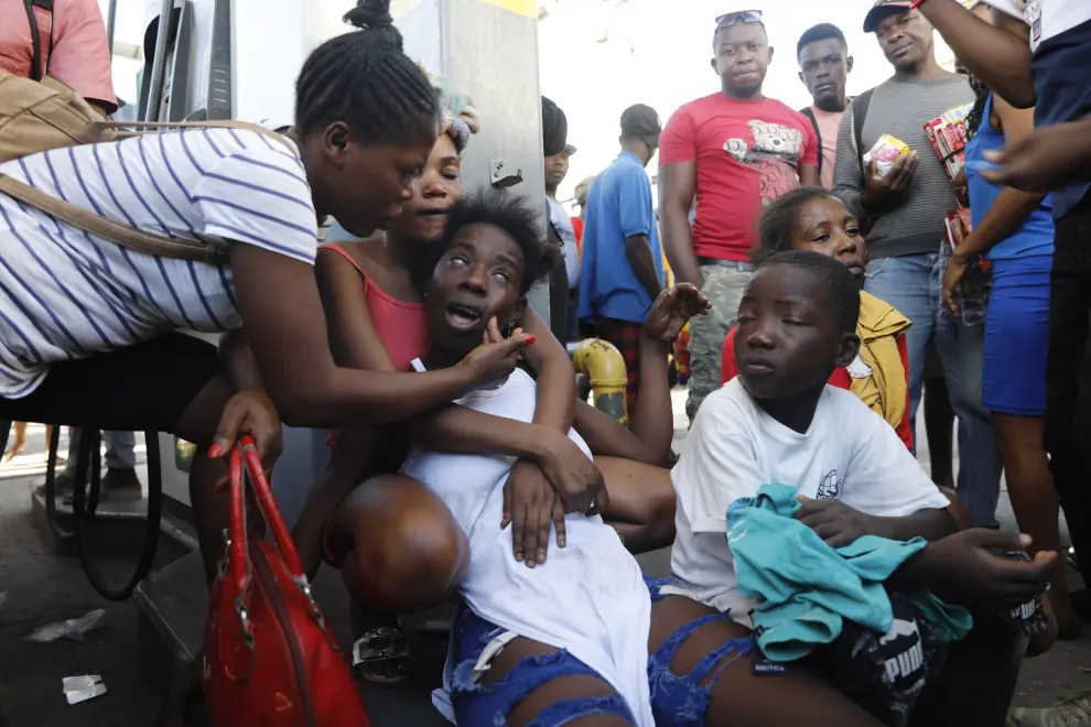 The relative of a person found dead in the street reacts after an overnight shooting in the Petion Ville neighborhood of Port-au-Prince, Haiti, Monday, March 18, 2024. (AP Photo/Odelyn Joseph) 


Associated Press / LaPresse
Only italy and Spain