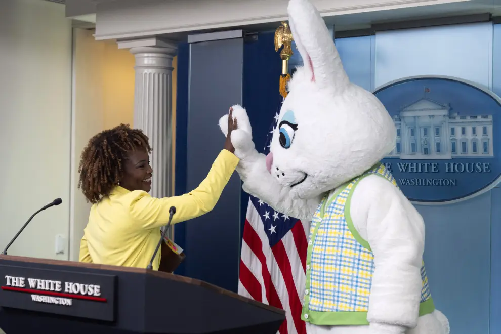 White House press secretary Karine Jean-Pierre arrives as the Easter Bunny stands at the podium before a briefing at the White House, Monday, April 1, 2024, in Washington. (AP Photo/Mark Schiefelbein)