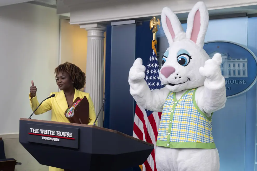 White House press secretary Karine Jean-Pierre arrives as the Easter Bunny stands at the podium before a briefing at the White House, Monday, April 1, 2024, in Washington. (AP Photo/Mark Schiefelbein)