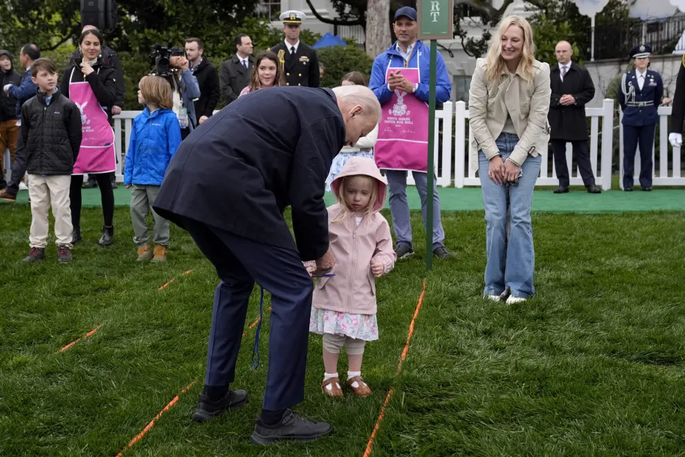President Joe Biden, left, participates in the White House Easter Egg Roll on the South Lawn of the White House, Monday, April 1, 2024, in Washington. (AP Photo/Evan Vucci)