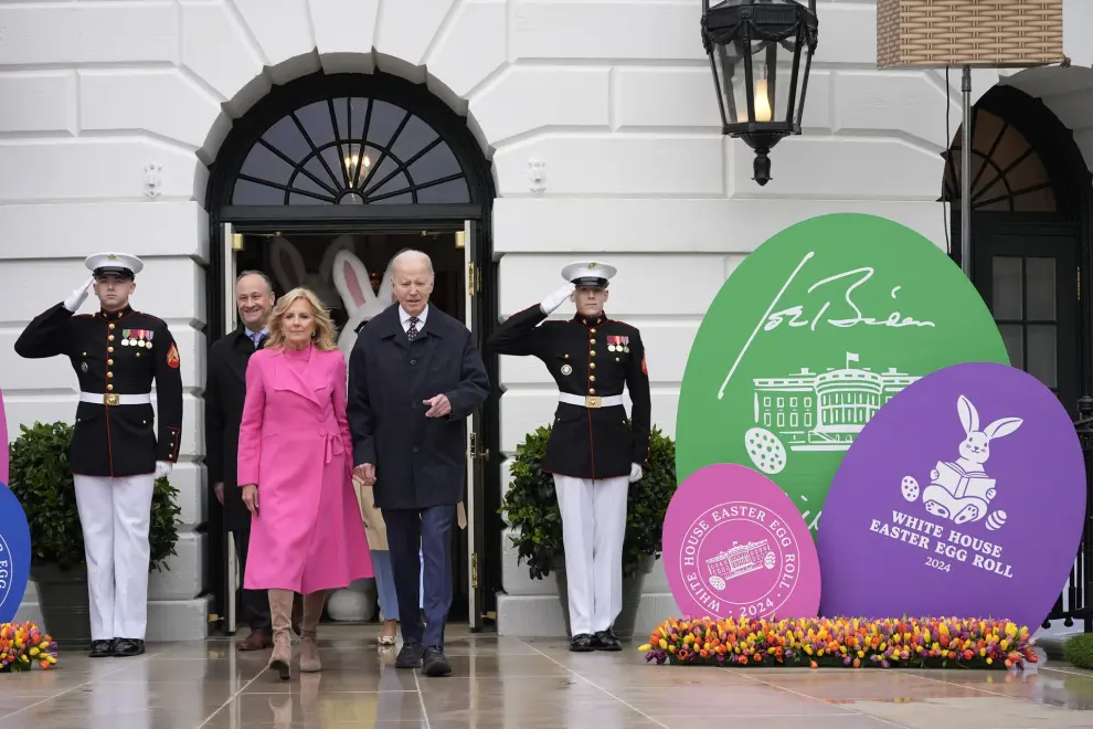 President Joe Biden, center right, and first lady Jill Biden, center left, arrive at the White House Easter Egg Roll on the South Lawn of the White House, Monday, April 1, 2024, in Washington. In background at second left is second gentleman Doug Emhoff. (AP Photo/Evan Vucci)