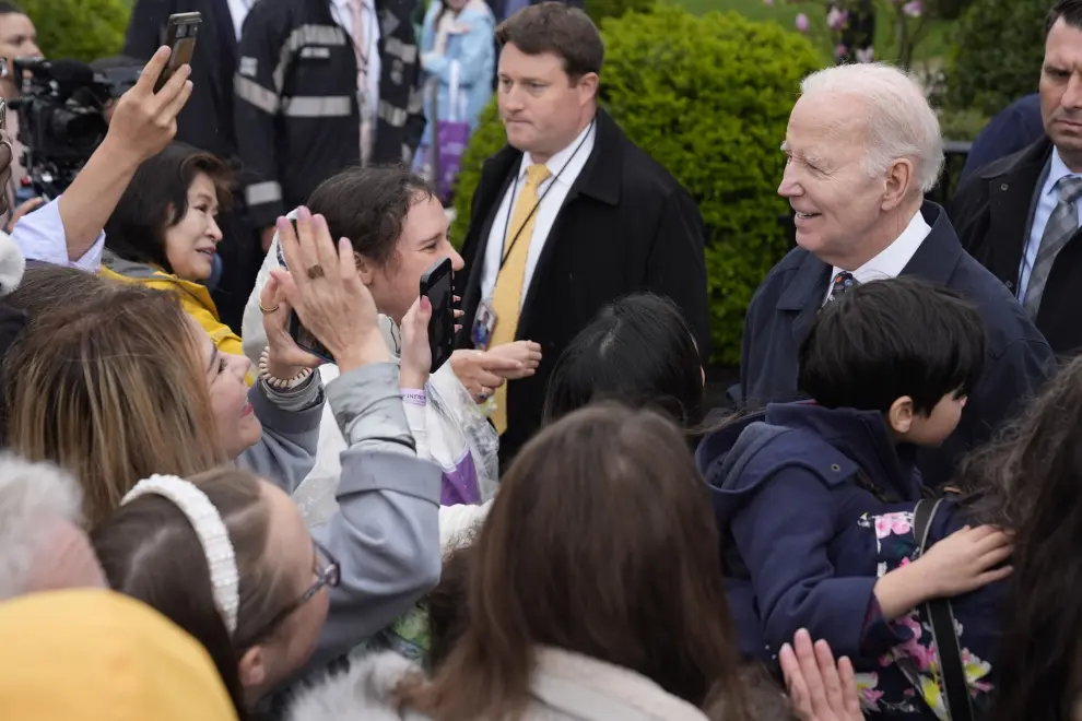 President Joe Biden, right, greets guests at the White House Easter Egg Roll on the South Lawn of the White House, Monday, April 1, 2024, in Washington. (AP Photo/Evan Vucci)