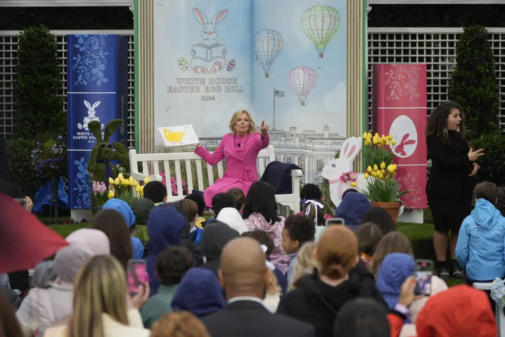 First lady Jill Biden reads a story during The White House Easter Egg Roll festivities in The White House, Monday, April 1, 2024, in Washington. (AP Photo/Mark Schiefelbein)