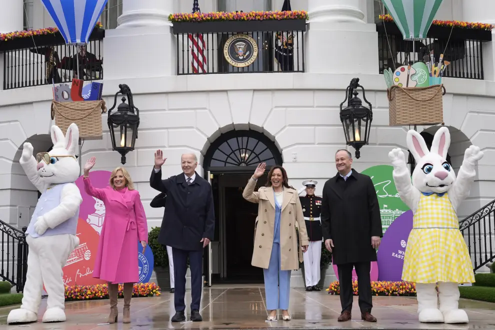 President Joe Biden, center left, and Vice President Kamala Harris, center right, accompanied by first lady Jill Biden, left, and second gentleman Doug Emhoff, right, wave at the White House Easter Egg Roll on the South Lawn of the White House, Monday, April 1, 2024, in Washington. (AP Photo/Evan Vucci)