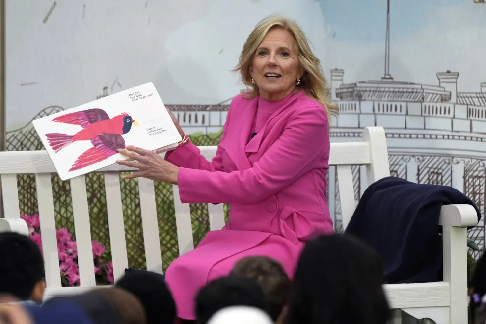 First lady Jill Biden reads a story during The White House Easter Egg Roll festivities in The White House, Monday, April 1, 2024, in Washington. (AP Photo/Mark Schiefelbein)