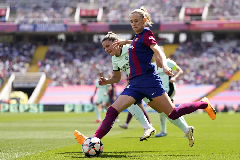 Barcelona's Fridolina Rolfo attempts a shot past Chelsea's Johanna Rytting Kaneryd during the women's Champions League semifinals, first leg, soccer match between FC Barcelona and Chelsea FC at the Olympic Stadium, in Barcelona, Spain, Saturday, April 20, 2024. (AP Photo/Jose Breton)