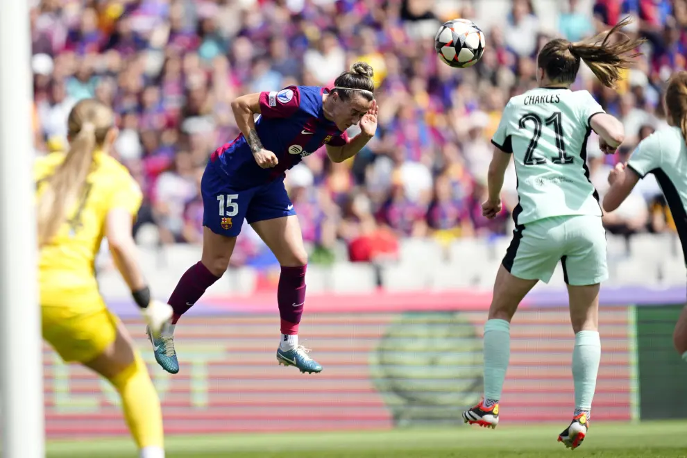Barcelona's Lucy Bronze heads the ball during the women's Champions League semifinals, first leg, soccer match between FC Barcelona and Chelsea FC at the Olympic Stadium, in Barcelona, Spain, Saturday, April 20, 2024. (AP Photo/Jose Breton)
