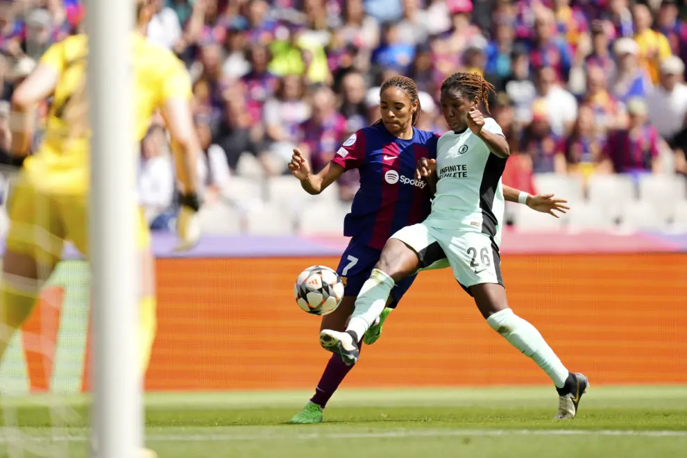 Barcelona's Salma Paralluelo vies for the ball with Chelsea's Kadeisha Buchanan, right, during the women's Champions League semifinals, first leg, soccer match between FC Barcelona and Chelsea FC at the Olympic Stadium, in Barcelona, Spain, Saturday, April 20, 2024. (AP Photo/Jose Breton)