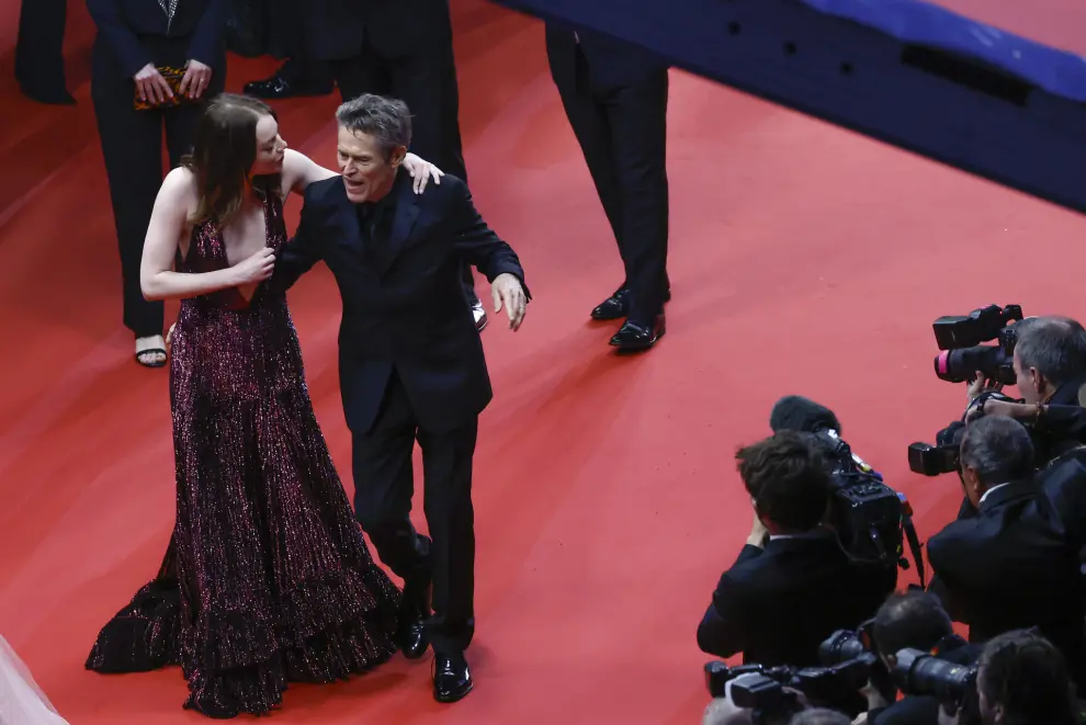 Emma Stone, left, and Willem Dafoe pose for photographers upon departure from the premiere of the film 'Kinds of Kindness' at the 77th international film festival, Cannes, southern France, Friday, May 17, 2024. (Photo by Millie Turner/Invision/AP)