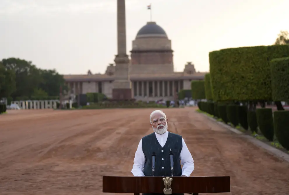 Indian Prime Minister Narendra Modi speaks to the media outside the Rashtrapati Bhavan after receiving a letter from the President of India, Droupadi Murmu, inviting him to form the next central government, in New Delhi, India, Friday, June 7, 2024. (AP Photo/Manish Swarup)
