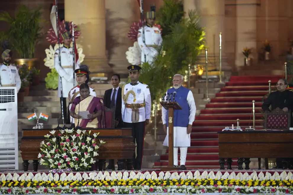 Narendra Modi, right, is sworn-in as the Prime Minister of India by President Draupadi Murmu, left, at the Rashtrapati Bhawan, in New Delhi, India, Sunday, June 9, 2024. The 73-year-old leader is only the second Indian prime minister to retain power for a third term. (AP Photo/Manish Swarup)