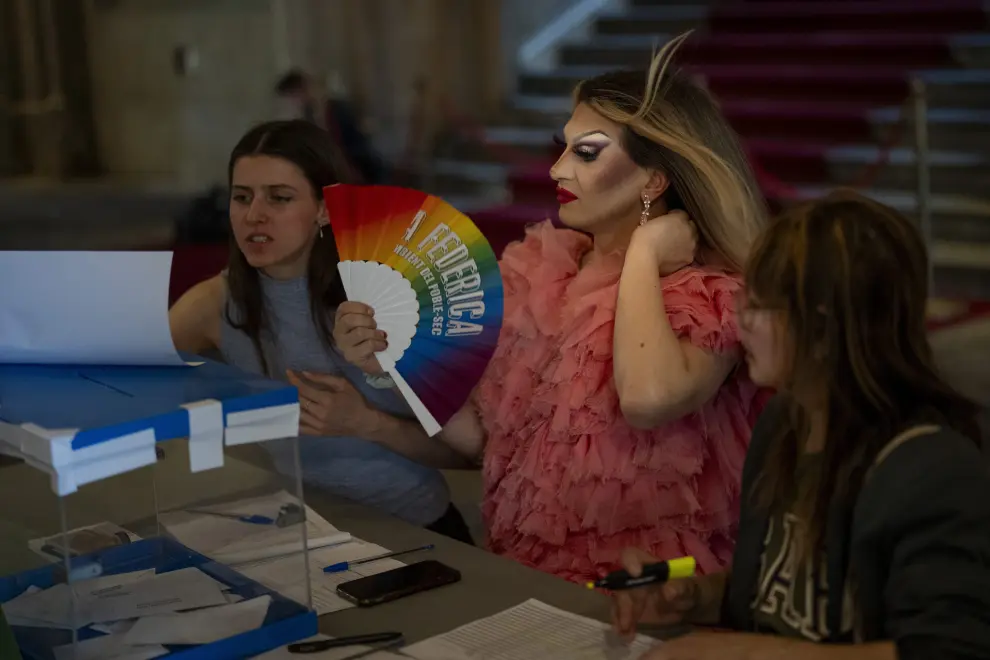 Drag queen Bernat Bodes, known as Pitita, fans herself as she performs her duties as president of a polling station during the European Parliament elections in Barcelona, Spain, Sunday, June 9, 2024. Polling stations have opened across Europe as voters from 20 countries cast ballots in elections that are expected to shift the European Union’s parliament to the right and could reshape the future direction of the world’s biggest trading bloc. (AP Photo/Emilio Morenatti)