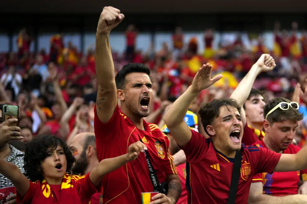Fans cheer before the start of a round of sixteen match between Spain and Georgia at the Euro 2024 soccer tournament in Cologne, Germany, Sunday, June 30, 2024. (AP Photo/Manu Fernandez)