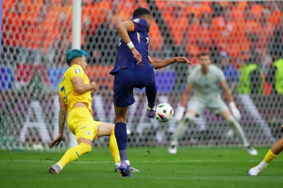 Cody Gakpo of the Netherlands scores goal  0-1 during the Euro 2024 soccer match between Romania and Netherlands at the Munich Football Arena , Munich  , Germany - Tuesday July 2 , 2024. Sport - Soccer . (Photo by Spada/LaPresse) [[[AP/LAPRESSE]]]