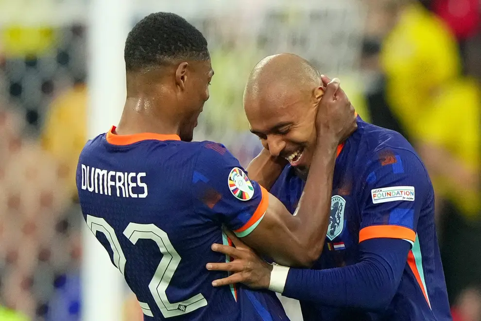 Donyell Malen of the Netherlands and Denzel Dumfries of the Netherlands .celebrate after scoring 0-3  during the Euro 2024 soccer match between Romania and Netherlands at the Munich Football Arena , Munich  , Germany - Tuesday July 2 , 2024. Sport - Soccer . (Photo by Spada/LaPresse) [[[AP/LAPRESSE]]]