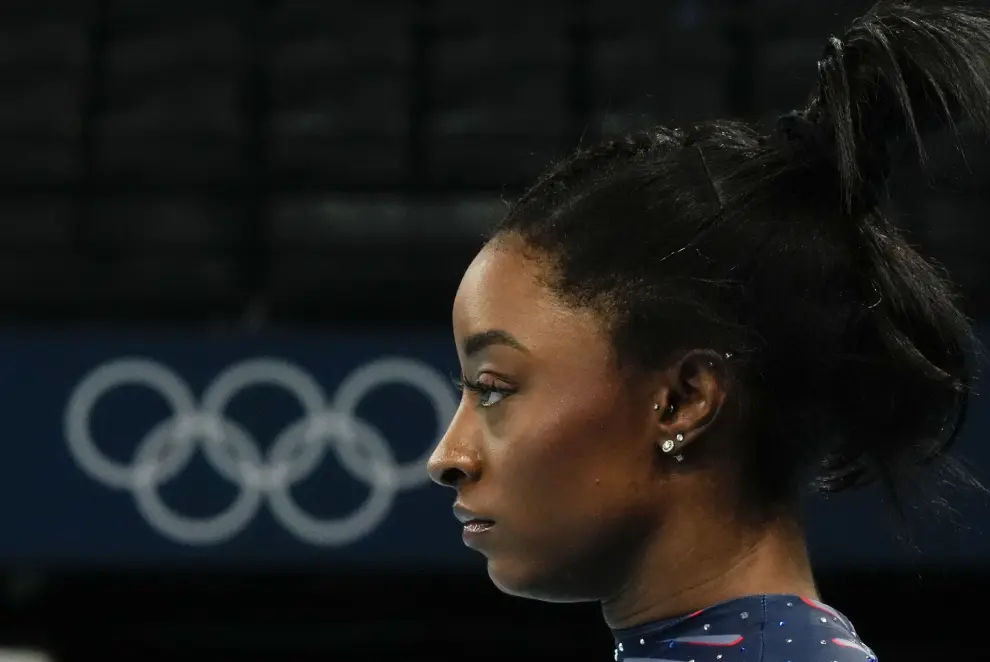 Simone Biles of the United States focuses during a gymnastics training session at Bercy Arena at the 2024 Summer Olympics, Thursday, July 25, 2024, in Paris, France. (AP Photo/Francisco Seco)