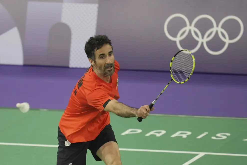 Spain's Pablo Abian plays against Sri Lanka's Viren Nettasinghe during their men's singles badminton group stage match at the 2024 Summer Olympics, Tuesday, July 30, 2024, in Paris, France. (AP Photo/Kin Cheung)