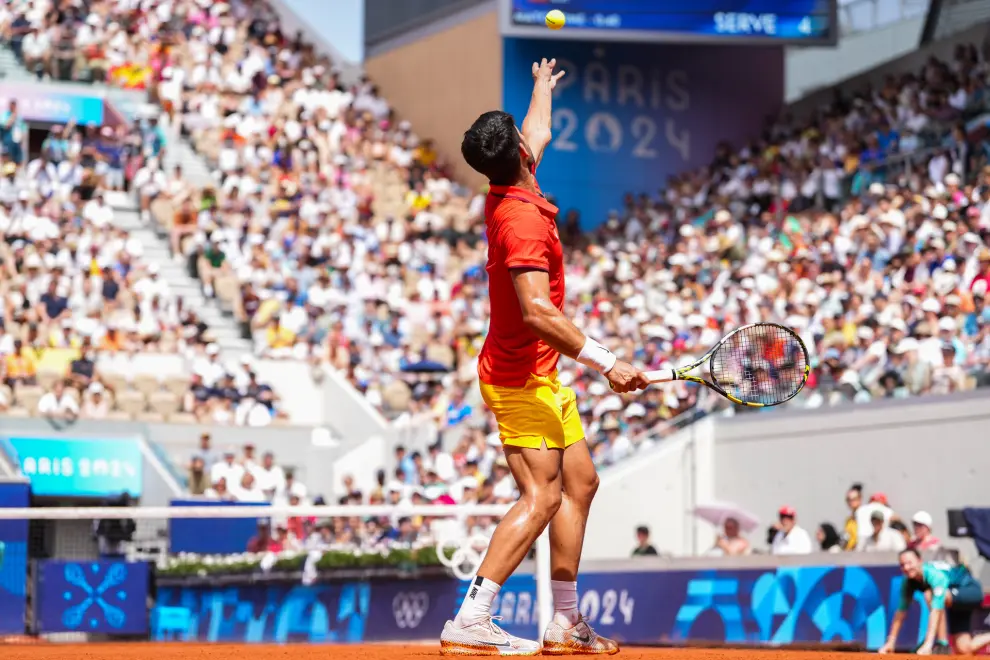 Carlos Alcaraz of Spain in action against Roman Safiullin of Team Individual Neutral Athletes during the Mens Singles Third Round at Roland Garros during the 2024 Paris Summer Olympic Games in Paris on July 31, 2024 in Paris, France. France...AFP7 ..31/07/2024 ONLY FOR USE IN SPAIN [[[EP]]]