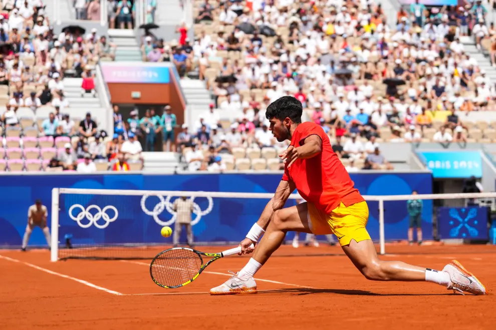 Carlos Alcaraz of Spain in action against Roman Safiullin of Team Individual Neutral Athletes during the Mens Singles Third Round at Roland Garros during the 2024 Paris Summer Olympic Games in Paris on July 31, 2024 in Paris, France. France...AFP7 ..31/07/2024 ONLY FOR USE IN SPAIN [[[EP]]]