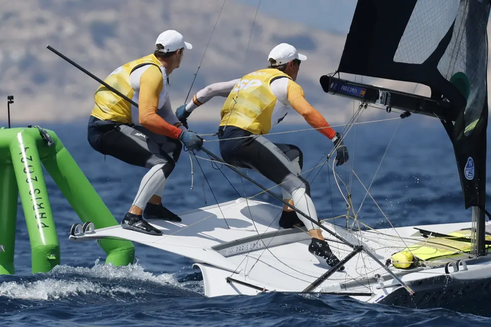 Marseille (France), 02/08/2024.- Diego Botin le Chever (L) and Florian Trittel Paul of Spain compete in the Men's 49erFX class medal race of the Sailing events in the Paris 2024 Olympic Games, at the Marseille Marina in Marseille, France, 02 August 2024. (Francia, España, Marsella) EFE/EPA/SEBASTIEN NOGIER