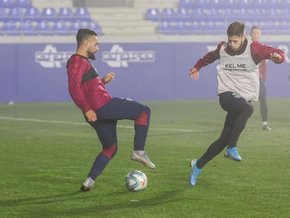 Ivi López y Miguelón, en el entrenamiento de Año Nuevo en El Alcoraz.