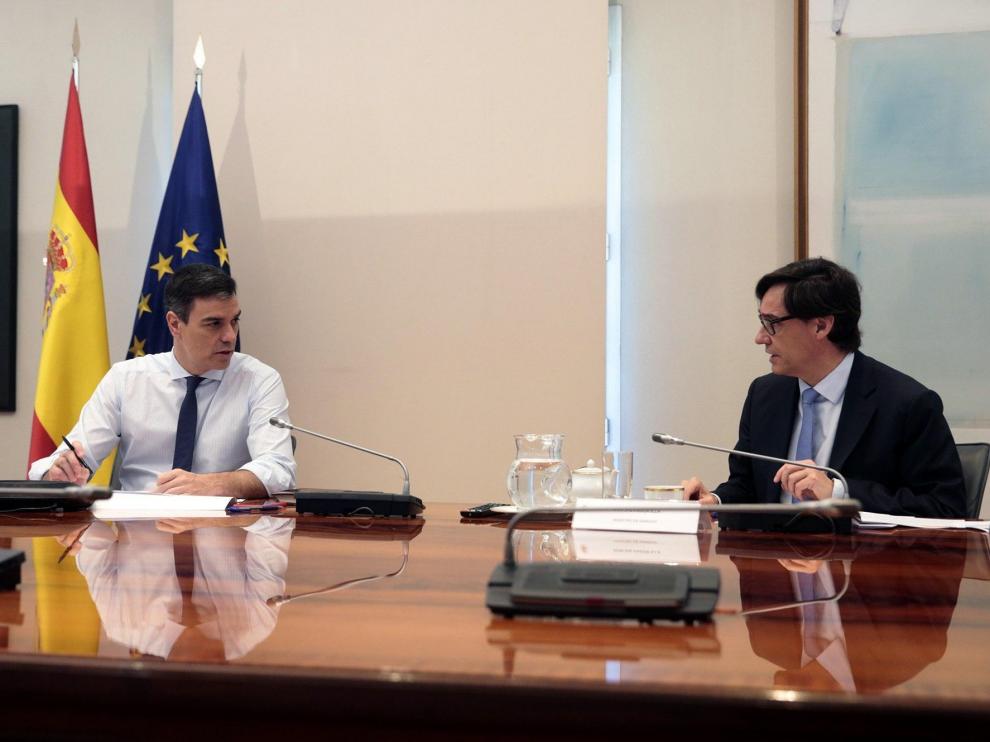 Sánchez, junto a Salvador Illa durante la videoconferencia con los presidentes autonómicos.
