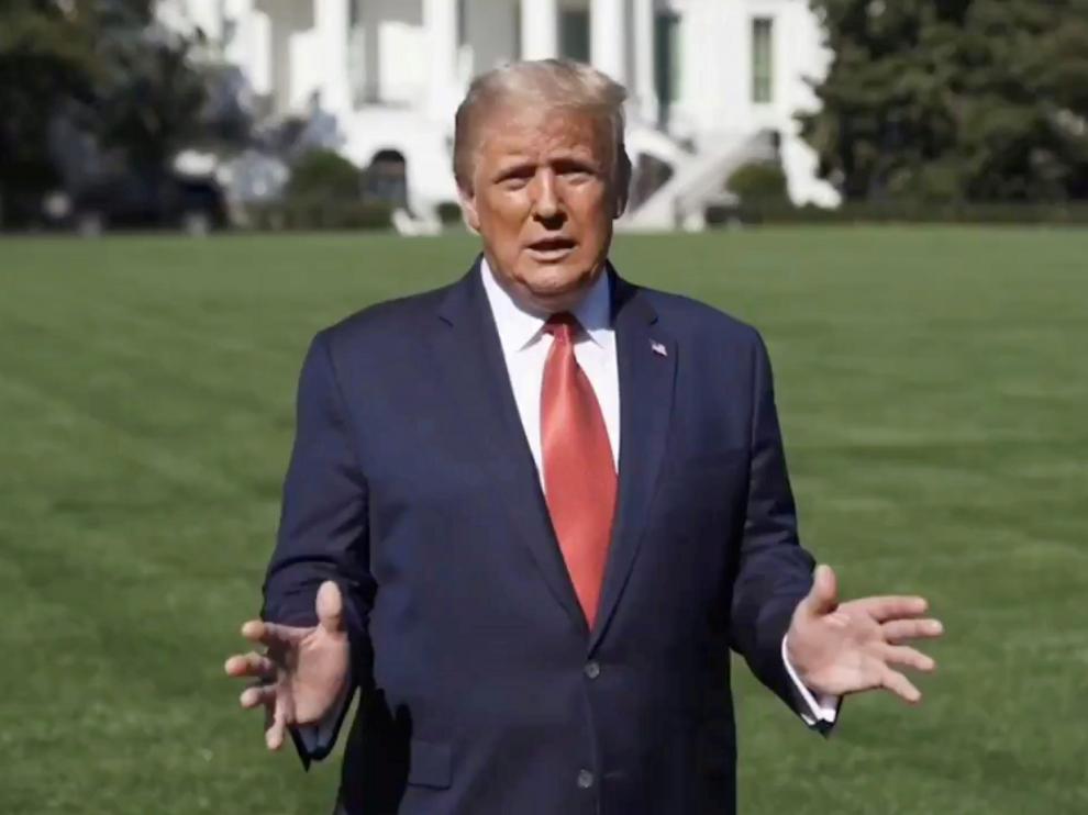 FILE PHOTO: U.S. President Donald Trump speaks outside the White House in Washington