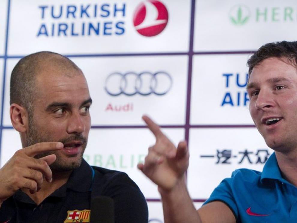 Pep Guardiola y Leo Messi durante la rueda de prensa de hoy