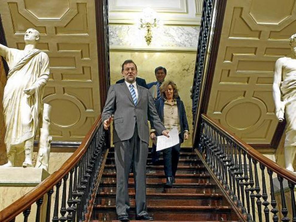 Mariano Rajoy y Soraya Sáenz de Santamaría, antes de la rueda de prensa en el Congreso.
