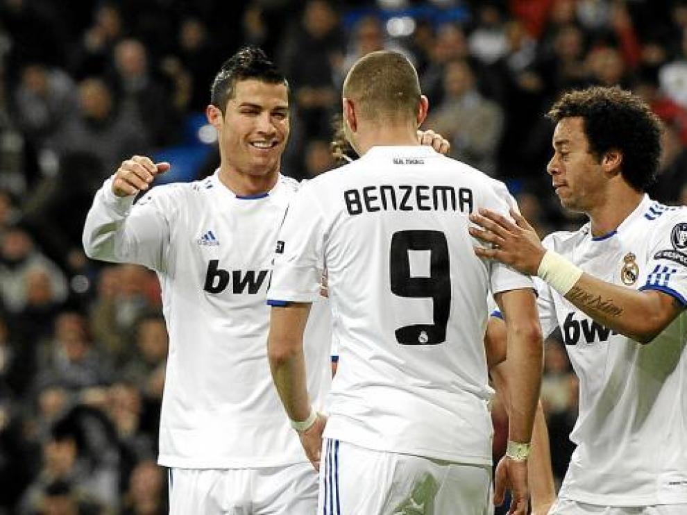 Benzemá, Cristiano Ronaldo y Marcelo, celebran un gol en una imagen de archivo.