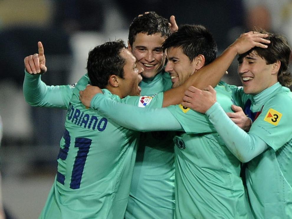 Los jugadores celebran el triunfo