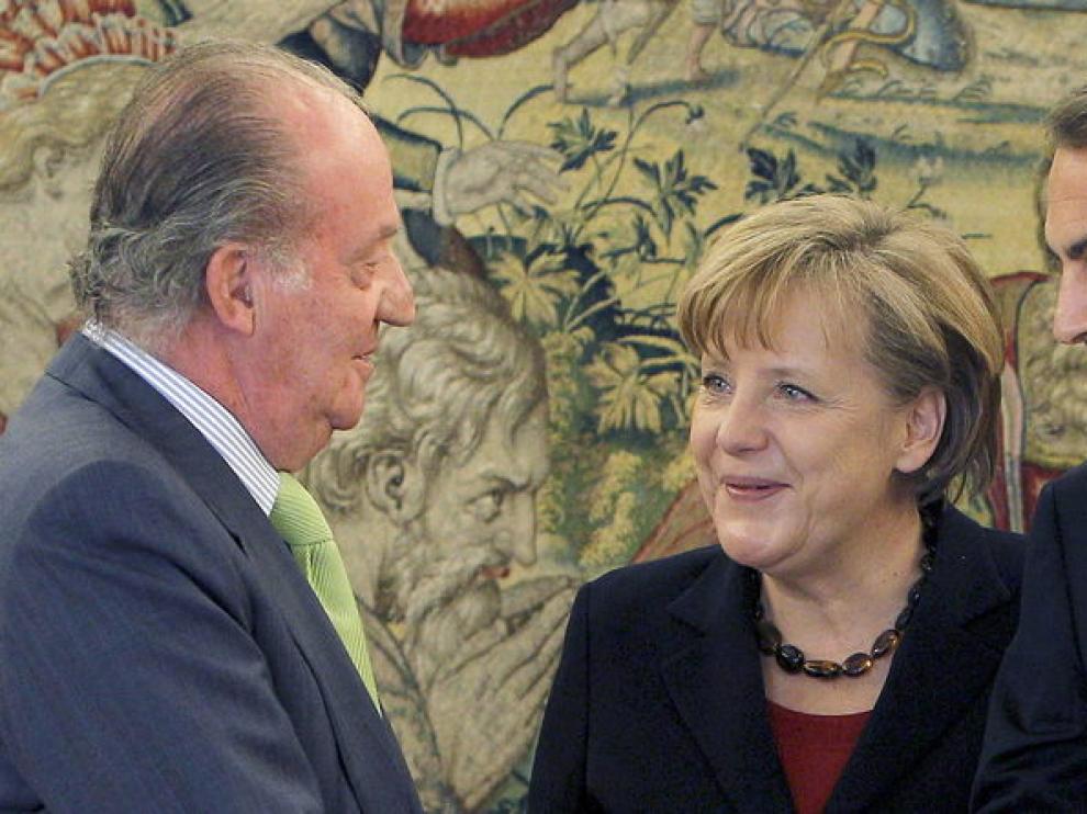 Angela Merkel, junto a José Luis Rodríguez Zapatero y el Rey