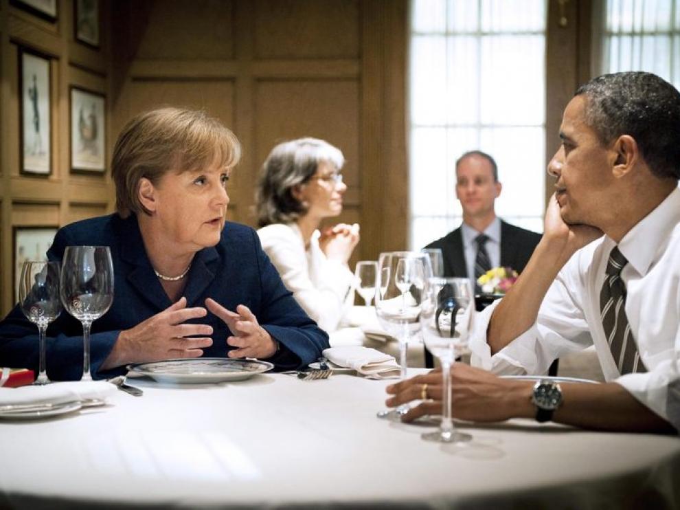 Angela Merkel y Barak Obama en una cena durante la visita de la canciller a EE. UU.