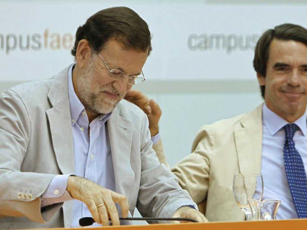 Mariano Rajoy y José María Aznar en el acto de FAES