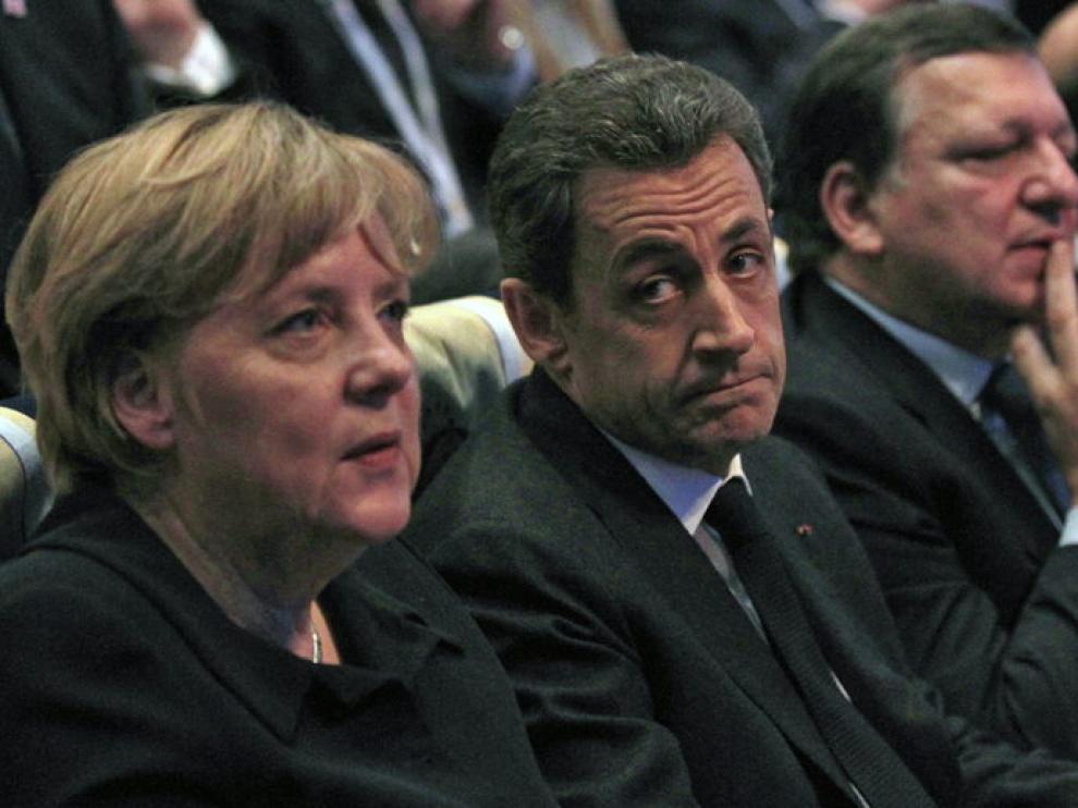 Angela Merkel y Nicolás Sarkozy, durante el Congreso del PPE